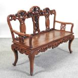 A Chinese carved hardwood bench,