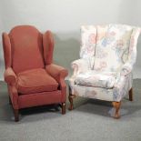 An early 20th century upholstered wing back armchair,