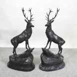 A pair of large bronze models of stags,