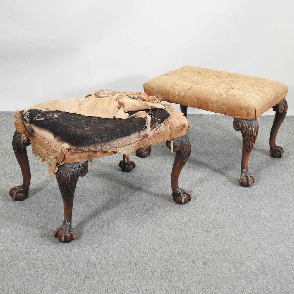 A pair of 19th century carved mahogany footstools,