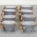 A set of galvanized metal planters,