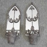 A pair of garden mirrors,