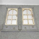 A pair of grey painted shutter wall mirrors,