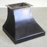 A black painted iron fire hood,