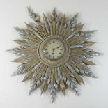 An early 20th century sunburst wall clock