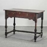 An 18th century oak side table,