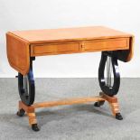 A Biedermeier style maple and ebonised sofa table,