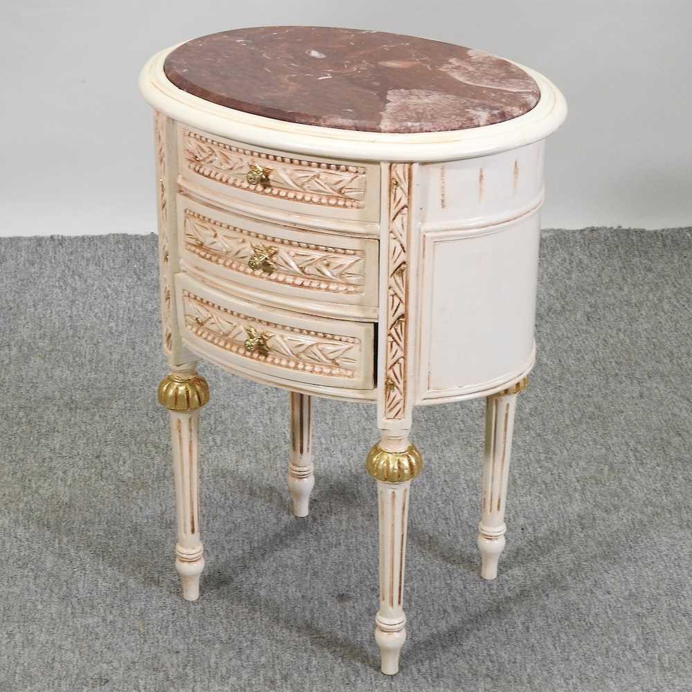 A modern French style cream painted bedside cabinet,