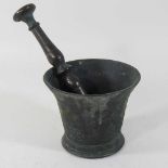 A 17th century bronze pestle and mortar,
