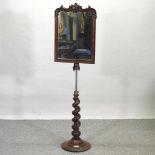 A Victorian walnut mirror,