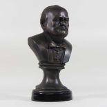 A modern bronzed portrait bust of Winston Churchill