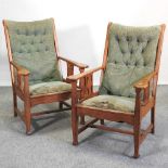 A pair of Arts and Crafts light oak armchairs,