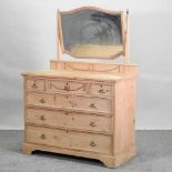 An Edwardian stripped pine dressing chest,