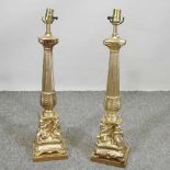 A pair of large gilt painted table lamps,