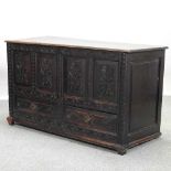 A 19th century carved oak mule chest