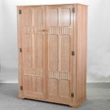 A mid 20th century limed oak double wardrobe,