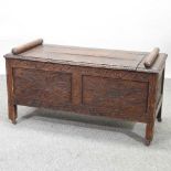 An early 20th century oak window seat,