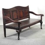 An 18th century oak settle,