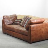 A modern brown leather upholstered sofa