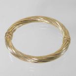Withdrawn-A large 9 carat gold bangle,