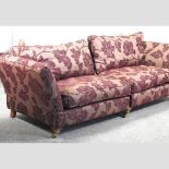 A purple floral upholstered knole sofa,