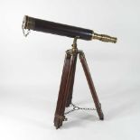 A reproduction wooden telescope,
