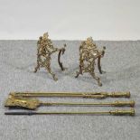 A pair of ornate 19th century brass fire dogs
