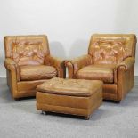 A pair of tan leather upholstered armchairs