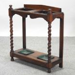 An early 20th century oak stick stand,