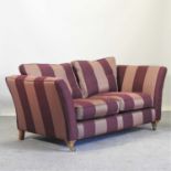An Ashley Manor burgundy striped upholstered sofa,