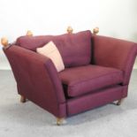 A burgundy upholstered knole armchair,