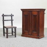 An early 20th century oak hanging cabinet,