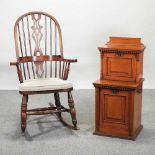 An oak Windsor style rocking chair,