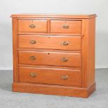 An Edwardian satin walnut chest,