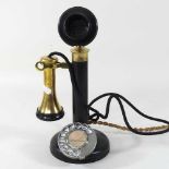 An early 20th century brass mounted stick telephone