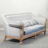 A large gilt framed and pale blue upholstered sofa,