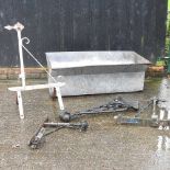 A galvanised tank, together with various metal brackets