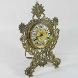 An ornate 19th century brass cased strutt clock,