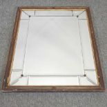 An antique style bevelled glass wall mirror,