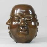 A modern brass four faced Buddha,