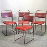 A set of four mid 20th century tubular metal stacking chairs