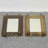 A pair of Arts and Crafts brass framed wall mirrors