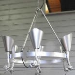 A pair of silver painted iron chandeliers
