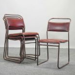 A set of four mid 20th century stacking chairs,