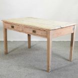 An early 20th century oak writing table,