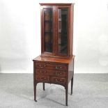 An Edwardian mahogany and crossbanded display cabinet