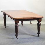 A late Victorian walnut wind out extending dining table