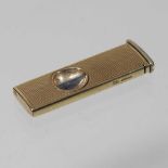 A 9 carat gold cigar cutter