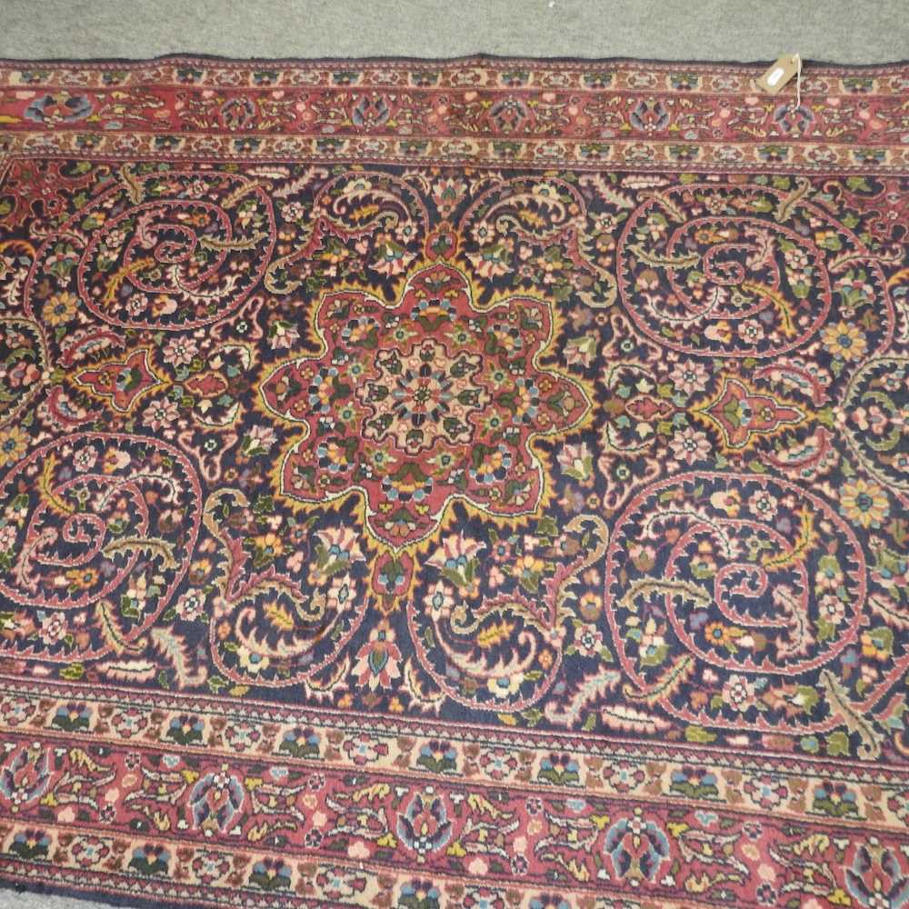 A Persian woollen rug, with all over foliate design, - Image 3 of 4