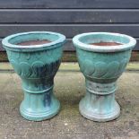 A pair of turquoise glazed pottery garden pots